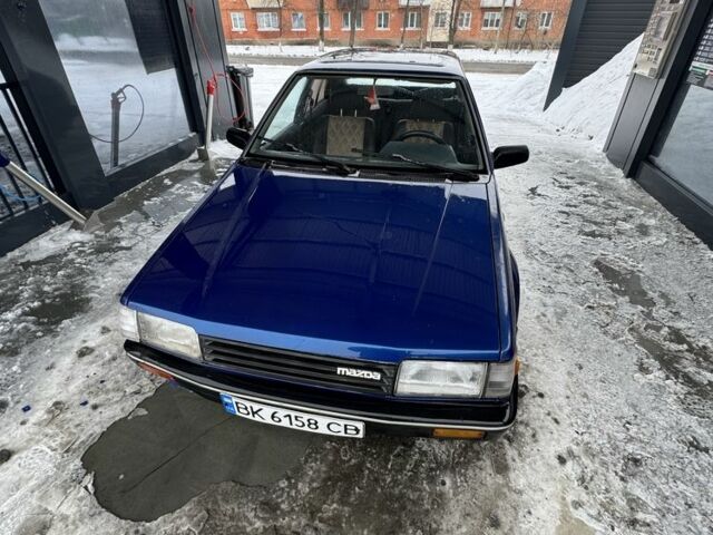 Синій Мазда 323, об'ємом двигуна 1.6 л та пробігом 390 тис. км за 510 $, фото 1 на Automoto.ua