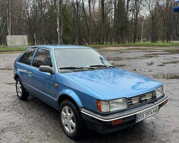 Синий Мазда 323, объемом двигателя 1.32 л и пробегом 220 тыс. км за 950 $, фото 1 на Automoto.ua