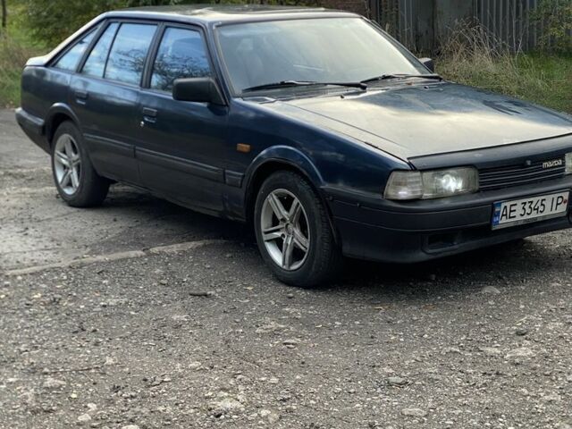 Синий Мазда 323, объемом двигателя 2 л и пробегом 465 тыс. км за 1000 $, фото 1 на Automoto.ua