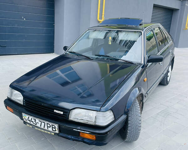 Синий Мазда 323, объемом двигателя 1.5 л и пробегом 500 тыс. км за 899 $, фото 1 на Automoto.ua