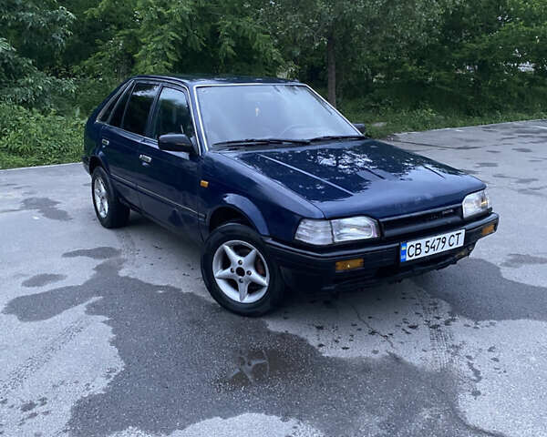 Синий Мазда 323, объемом двигателя 1.5 л и пробегом 505 тыс. км за 650 $, фото 1 на Automoto.ua