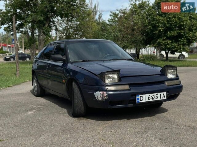 Синий Мазда 323, объемом двигателя 1.6 л и пробегом 250 тыс. км за 1200 $, фото 1 на Automoto.ua
