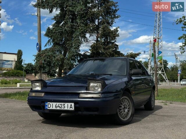 Синий Мазда 323, объемом двигателя 1.6 л и пробегом 250 тыс. км за 1200 $, фото 1 на Automoto.ua