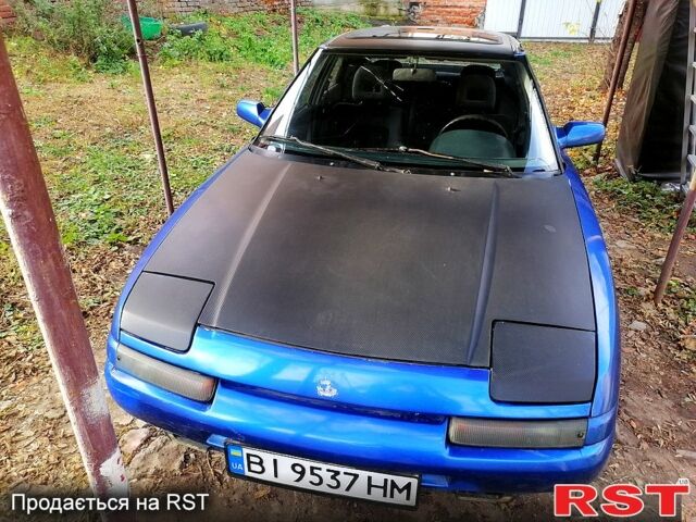 Синій Мазда 323, об'ємом двигуна 1.6 л та пробігом 150 тис. км за 1500 $, фото 1 на Automoto.ua