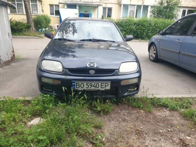 Синій Мазда 323, об'ємом двигуна 1.5 л та пробігом 245 тис. км за 1250 $, фото 1 на Automoto.ua