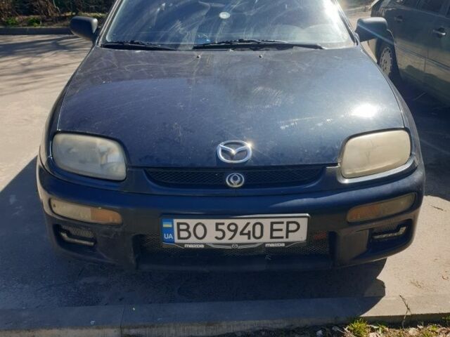 Синий Мазда 323, объемом двигателя 1.5 л и пробегом 260 тыс. км за 1500 $, фото 1 на Automoto.ua