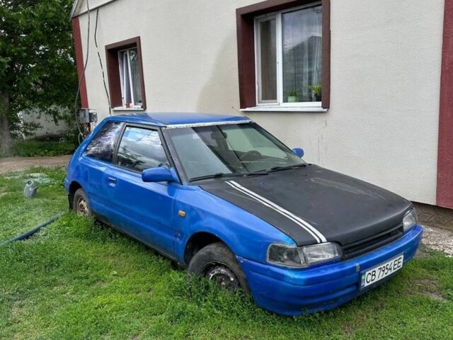 Синий Мазда 323, объемом двигателя 1.3 л и пробегом 999 тыс. км за 385 $, фото 1 на Automoto.ua
