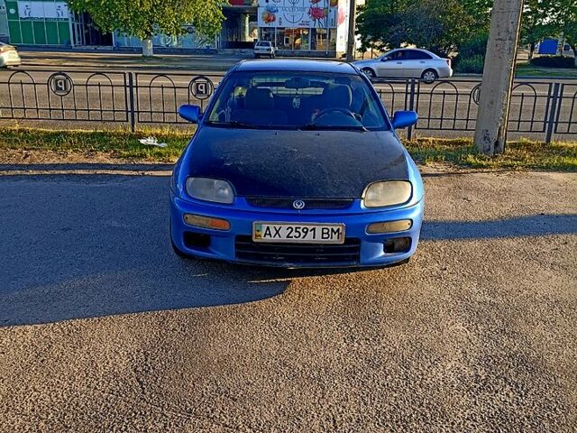 Синий Мазда 323, объемом двигателя 1.5 л и пробегом 165 тыс. км за 1200 $, фото 1 на Automoto.ua