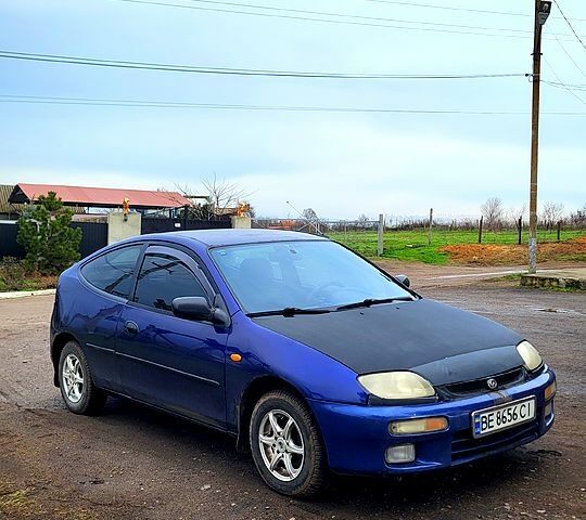 Синий Мазда 323, объемом двигателя 1.3 л и пробегом 200 тыс. км за 1150 $, фото 1 на Automoto.ua