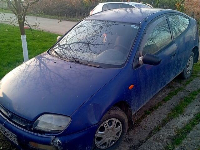 Синий Мазда 323, объемом двигателя 1.3 л и пробегом 333 тыс. км за 600 $, фото 1 на Automoto.ua