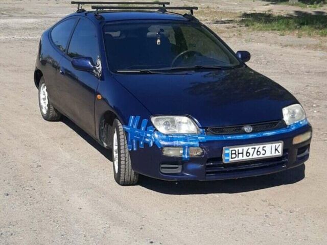 Синій Мазда 323, об'ємом двигуна 1.49 л та пробігом 450 тис. км за 1700 $, фото 1 на Automoto.ua