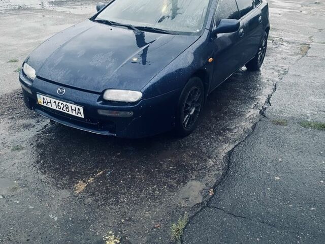 Синий Мазда 323, объемом двигателя 1.5 л и пробегом 350 тыс. км за 1350 $, фото 1 на Automoto.ua