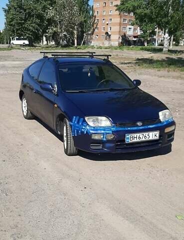 Синий Мазда 323, объемом двигателя 1.49 л и пробегом 450 тыс. км за 1700 $, фото 1 на Automoto.ua
