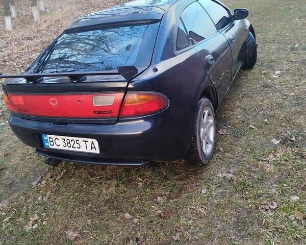 Синій Мазда 323, об'ємом двигуна 1.5 л та пробігом 300 тис. км за 1700 $, фото 1 на Automoto.ua