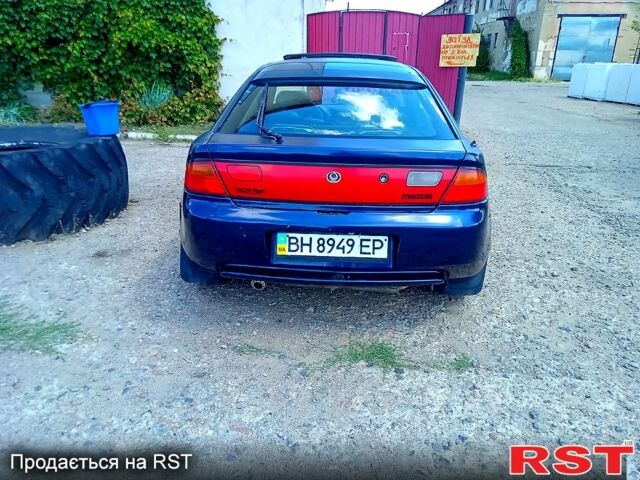 Синій Мазда 323, об'ємом двигуна 1.5 л та пробігом 350 тис. км за 1400 $, фото 1 на Automoto.ua