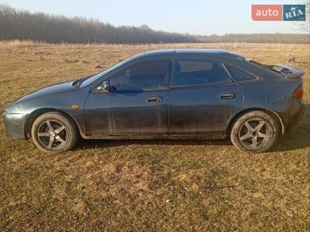 Синий Мазда 323, объемом двигателя 1.5 л и пробегом 200 тыс. км за 1500 $, фото 1 на Automoto.ua