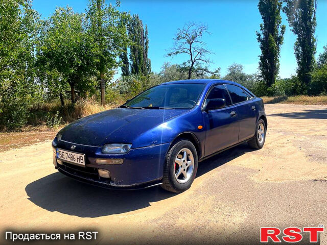 Синий Мазда 323, объемом двигателя 1.5 л и пробегом 400 тыс. км за 2000 $, фото 1 на Automoto.ua