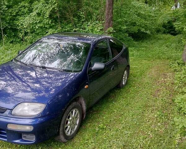 Синий Мазда 323, объемом двигателя 1.5 л и пробегом 254 тыс. км за 2900 $, фото 1 на Automoto.ua