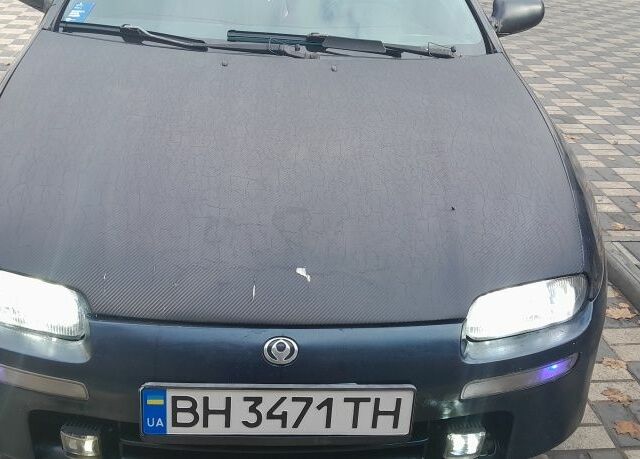 Синий Мазда 323, объемом двигателя 1.5 л и пробегом 499 тыс. км за 1600 $, фото 1 на Automoto.ua