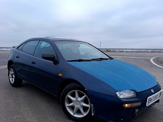 Синий Мазда 323, объемом двигателя 1.5 л и пробегом 296 тыс. км за 1800 $, фото 1 на Automoto.ua