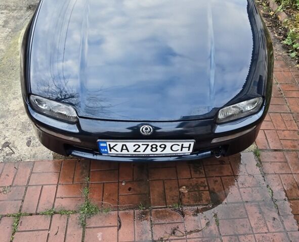 Синий Мазда 323, объемом двигателя 1.5 л и пробегом 237 тыс. км за 1800 $, фото 1 на Automoto.ua