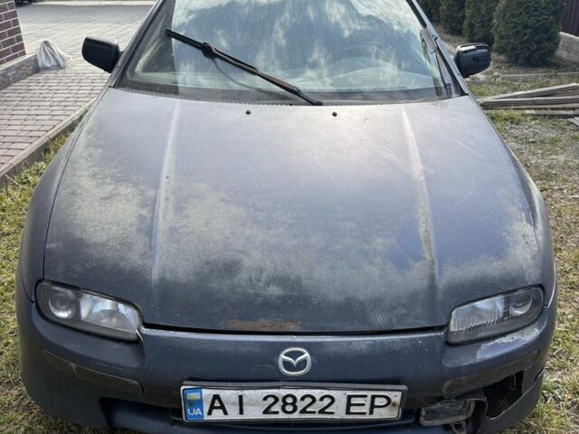 Синий Мазда 323, объемом двигателя 1.5 л и пробегом 478 тыс. км за 700 $, фото 1 на Automoto.ua