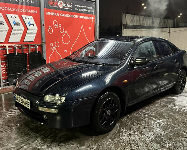Синій Мазда 323, об'ємом двигуна 1.49 л та пробігом 343 тис. км за 2100 $, фото 1 на Automoto.ua