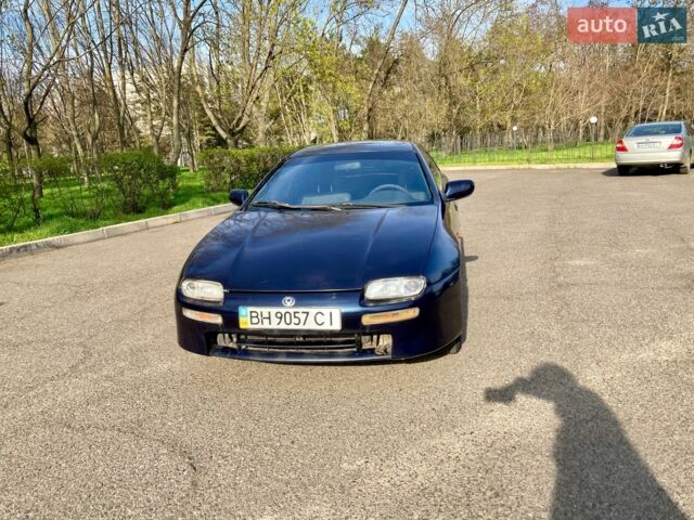 Синий Мазда 323, объемом двигателя 1.5 л и пробегом 250 тыс. км за 1680 $, фото 1 на Automoto.ua