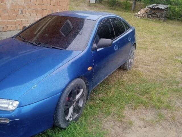 Синий Мазда 323, объемом двигателя 0 л и пробегом 200 тыс. км за 1003 $, фото 1 на Automoto.ua