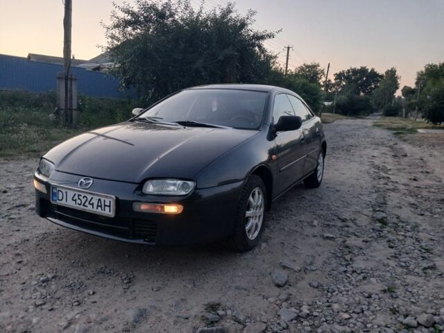 Синій Мазда 323, об'ємом двигуна 1 л та пробігом 370 тис. км за 2199 $, фото 1 на Automoto.ua