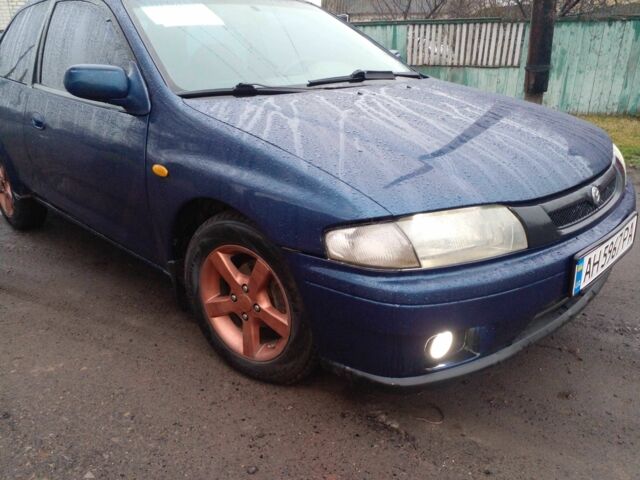Синий Мазда 323, объемом двигателя 1.3 л и пробегом 400 тыс. км за 1800 $, фото 1 на Automoto.ua