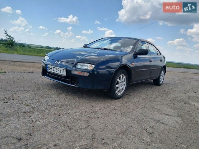 Синий Мазда 323, объемом двигателя 1.5 л и пробегом 370 тыс. км за 1500 $, фото 1 на Automoto.ua
