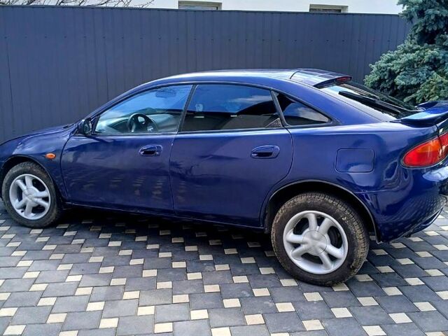 Синий Мазда 323, объемом двигателя 1.5 л и пробегом 300 тыс. км за 2500 $, фото 1 на Automoto.ua