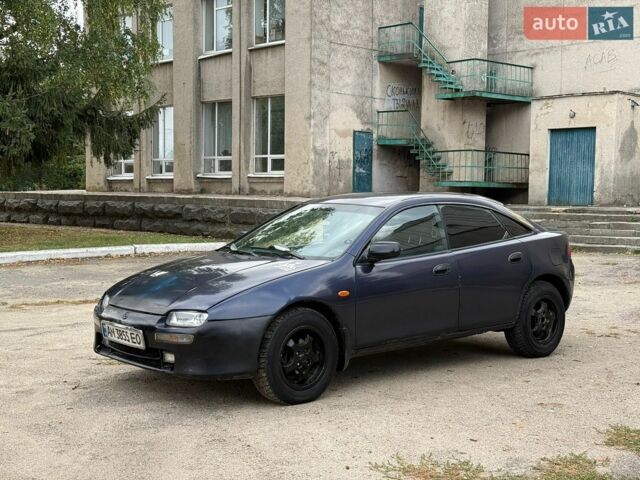 Синий Мазда 323, объемом двигателя 1.49 л и пробегом 450 тыс. км за 1100 $, фото 1 на Automoto.ua