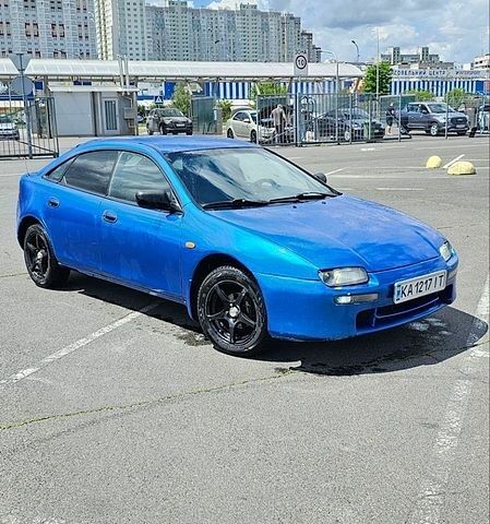 Синій Мазда 323, об'ємом двигуна 1.49 л та пробігом 388 тис. км за 1650 $, фото 1 на Automoto.ua