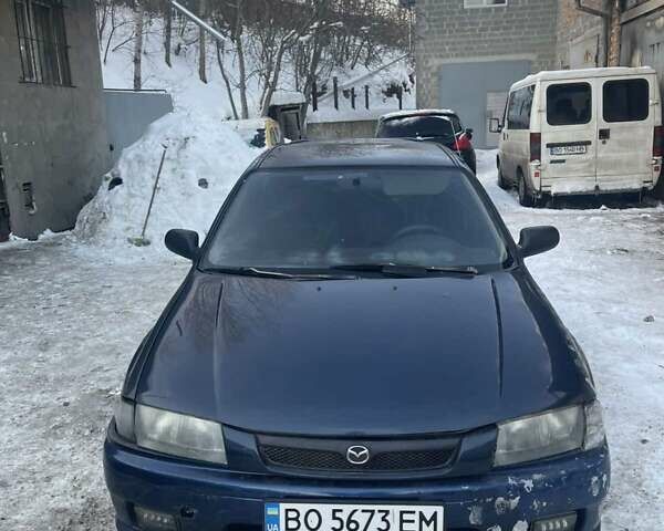 Синій Мазда 323, об'ємом двигуна 1.32 л та пробігом 250 тис. км за 850 $, фото 1 на Automoto.ua