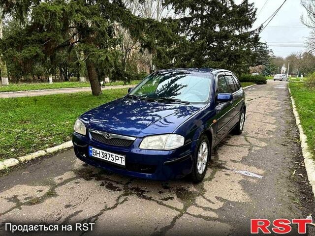 Синий Мазда 323, объемом двигателя 1.5 л и пробегом 315 тыс. км за 2400 $, фото 1 на Automoto.ua