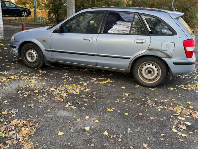 Синий Мазда 323, объемом двигателя 1.5 л и пробегом 395 тыс. км за 1800 $, фото 1 на Automoto.ua