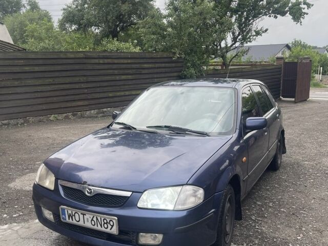 Синий Мазда 323, объемом двигателя 2 л и пробегом 295 тыс. км за 1250 $, фото 1 на Automoto.ua