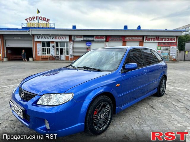 Синий Мазда 323, объемом двигателя 2 л и пробегом 300 тыс. км за 3000 $, фото 1 на Automoto.ua