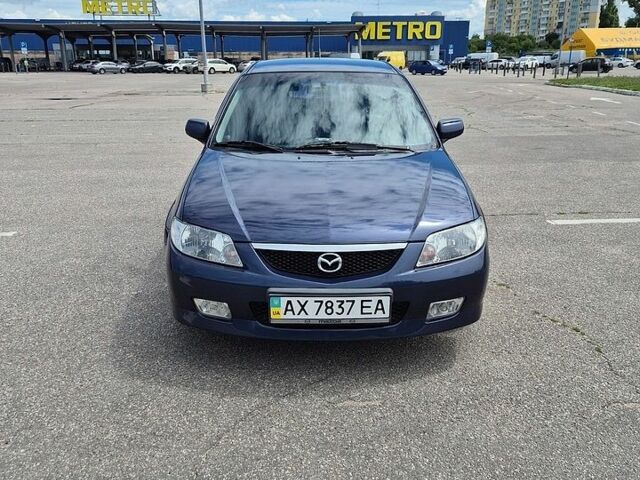 Синий Мазда 323, объемом двигателя 1.6 л и пробегом 350 тыс. км за 3100 $, фото 1 на Automoto.ua