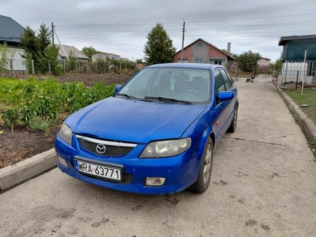Синій Мазда 323, об'ємом двигуна 2 л та пробігом 300 тис. км за 750 $, фото 1 на Automoto.ua
