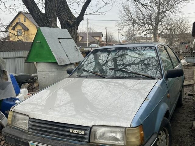 Синий Мазда 323, объемом двигателя 1.5 л и пробегом 293 тыс. км за 400 $, фото 1 на Automoto.ua