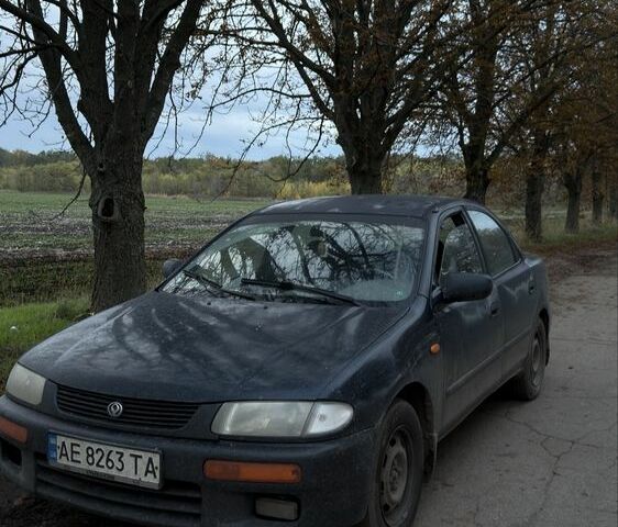 Синий Мазда 323, объемом двигателя 1.5 л и пробегом 450 тыс. км за 1311 $, фото 1 на Automoto.ua