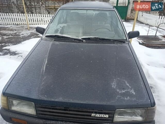 Синій Мазда 323, об'ємом двигуна 1.3 л та пробігом 223 тис. км за 1199 $, фото 1 на Automoto.ua