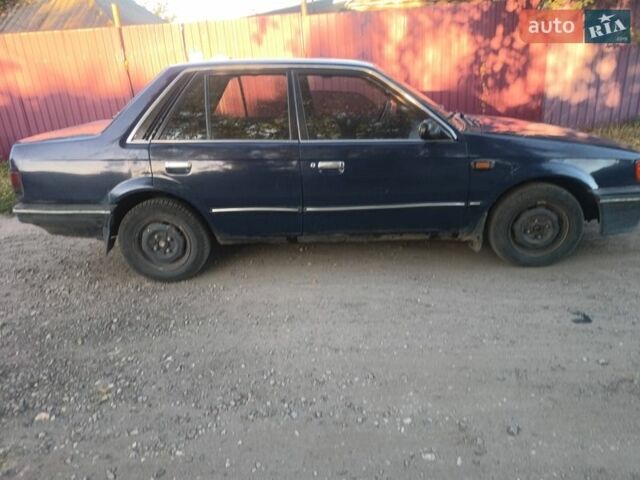 Синий Мазда 323, объемом двигателя 1.72 л и пробегом 300 тыс. км за 1000 $, фото 1 на Automoto.ua