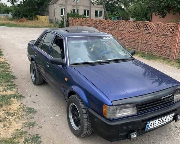 Синий Мазда 323, объемом двигателя 1.5 л и пробегом 300 тыс. км за 1350 $, фото 1 на Automoto.ua