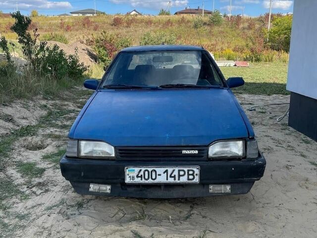 Синій Мазда 323, об'ємом двигуна 1.3 л та пробігом 215 тис. км за 700 $, фото 1 на Automoto.ua