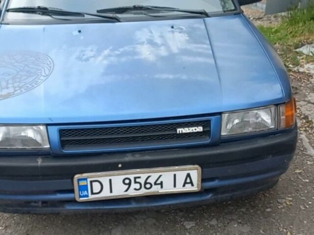 Синій Мазда 323, об'ємом двигуна 1.6 л та пробігом 250 тис. км за 702 $, фото 1 на Automoto.ua