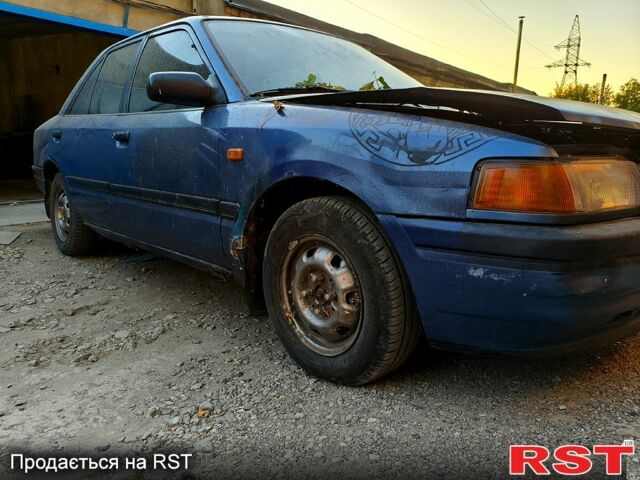 Синий Мазда 323, объемом двигателя 1.6 л и пробегом 234 тыс. км за 400 $, фото 1 на Automoto.ua